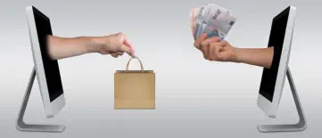 Ein Käufer übergibt einem anderen Geld